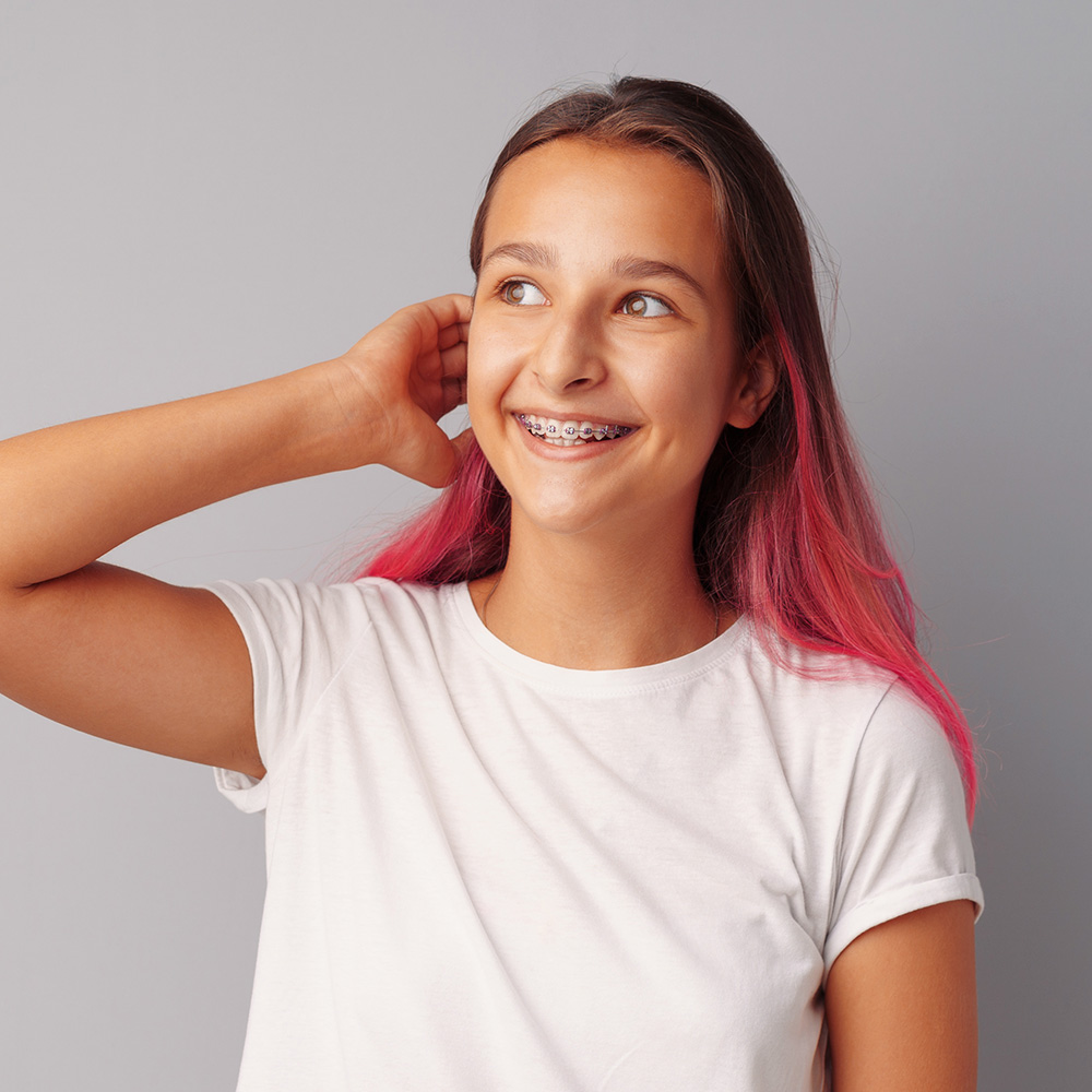 Female teen with braces smiling